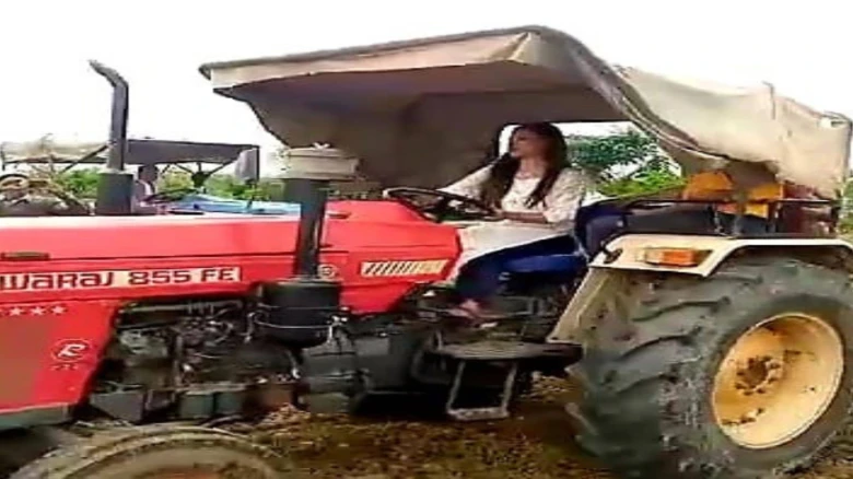 Assam’s ACS Officer Rides Tractor to Plough 300 Bigha Land for Plantation on World Environment Day