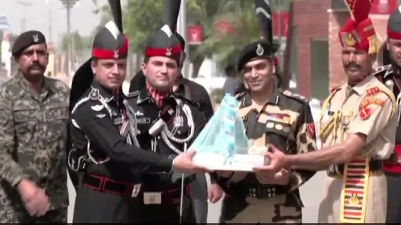 On Eid Ul-Adha, Indian and Pakistani soldiers exchange sweets at the Wagah border.