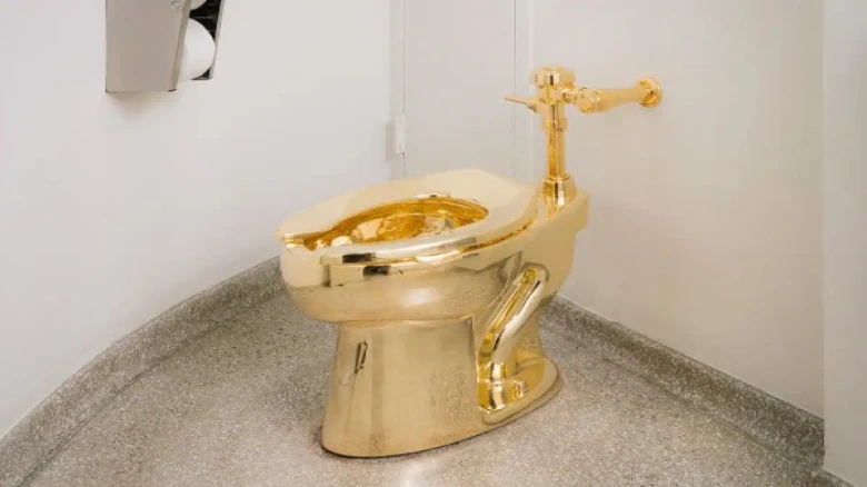 Police charges four men for stealing golden toilet worth  Rs 50 Crore in UK