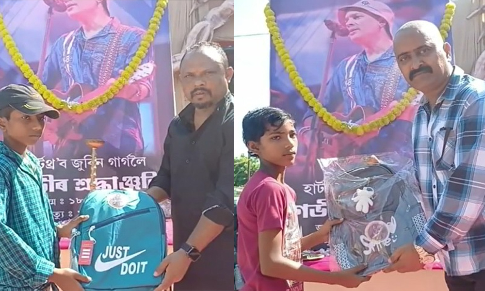 Sanitation Workers Distribute School Bags Adorned with Zubeen Garg's Image in Sivasagar